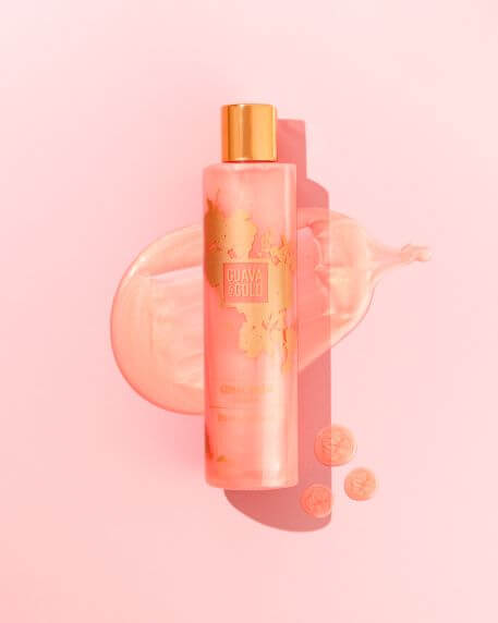 Guava & Gold Coral Beach shampoo on texture background