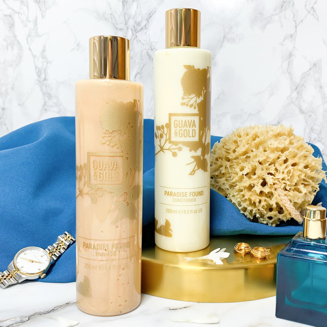Shampoo and conditioner bottles with sponge and watch